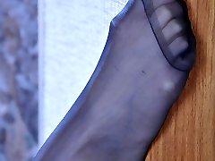 Hot sexpot takes off gorgeous open shoes to leek her smooth nylon clad feet