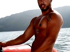 Big muscled bronzed twink Matheus stripping white briefs and teasing with his sexy ass on a boat