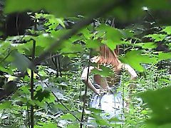 Spying on a girl changing in the woods