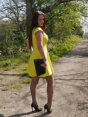 Hot Milf Jenna is wearing a beautiful yellow dress with a pair of sexy silk nylons and tall...