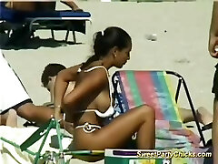 Sweet party chicks flashing their big knockers on the beach