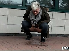 Chesty mature Bree pissing in the public