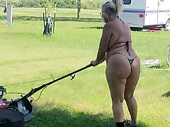 Got back to find wifey mowing in a thong bikini, her ass and hips jiggling with every step 