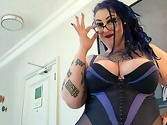 BBW Milf with thick tits and tattoos gives pierced cock a hand job.