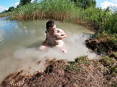 Unshaved Brunette Rubbing her Vagina with a Mud