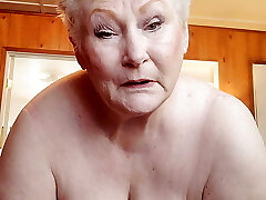 Nasty Grandmother Showcasing Off Her Fat Pussy As She Rubs It With A Dildo