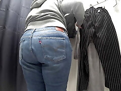 In a fitting room in a public store, the camera caught a chubby milf with a gorgeous ass in transparent panties. Pawg.