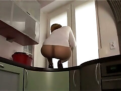 This fuckslut likes to show off her nylon frosted ass on top of the kitchen counter