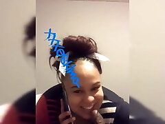 Ebony on phone to babyfather whilst sucking lollipop