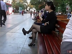Chinese Office Gal having a break and dangling her heels