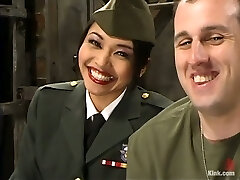Asian damsel in military uniform spanks a guy and sits on his face