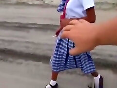 Filipina schoolgirl drilled outdoors in open field by tourist