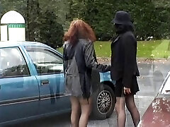 Two babes flashing their milk cans and pussy in public place