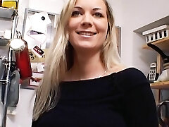 Outstanding German MILF with immense boobs dildoing her shaved labia in the kitchen