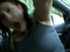 Kinky dark haired nympho with hefty nose fingers her soaking cunt in the car
