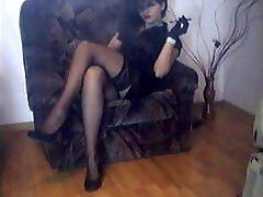 wife in nylon stockings and high high-heeled shoes crossing legs