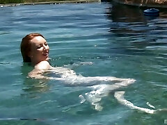 Red-haired teen babe Katy Kiss deep throats and fucks by the pool outdoors