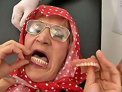 Toothless grandma (70+) takes out her dentures before romp