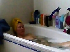 mom masturbates in bathtub