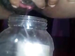 Sri Lankan Lady Pissing In a Bottle