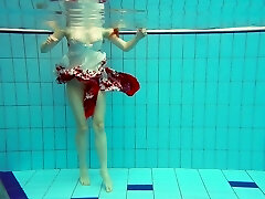 Sizzling red-haired model Marketa swimming naked in a pool Sizzling red-haired model Marketa swimming naked in a pool