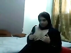 Middle East amateur brunette sex addict in traditional gown showcases off her tits