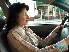 Horny brunette woman in the car