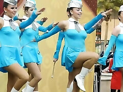 Molten young majorettes in blue flash their sexy legs as they