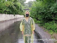 Teen in yellow raincoat flashes gash outdoors in the rain
