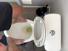 High on pot and fit to bust standing on public rest room desperate to urinate open wide guzzle up piss slut