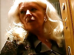 Old and busty German granny in stockings enjoys making a hard-on cum