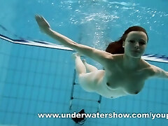 Dark Haired Kristy stripping underwater