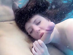 Super adorable stunner gives eager blowjob under the water