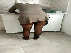 Turkish mature hijab woman village house cleaning the kitchen 
