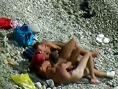 Wondrous chick and two horny guys enjoy foreplay on the beach when I spy them