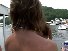 Spectacular slim teens flaunting on a party on a boat without bra
