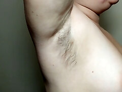 Ellie demonstrates her hairy armpits and plays with them