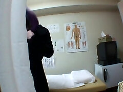 Hidden spy cam massage turns into fingering a female's pussy