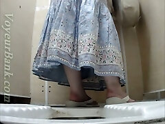Milky mature lady in dress pisses in the toilet room