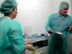 Doc and nurse stretching male patients ass - PREVIEW
