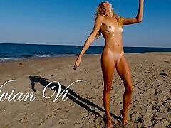 Naked Workout on the beach - a magnificent skinny milf with small tits
