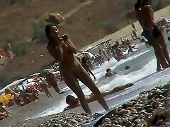 Voyeur video of nude girls having fun on a naturist beach
