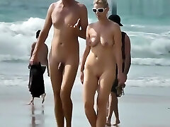 Amateur Naturist Beach Couple Walking Along The Beach Amateur Naturist Beach Couple Walking Along The Beach