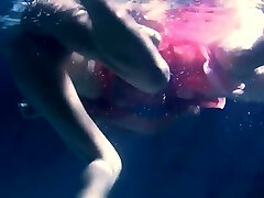 Two hot lesbians underwater fumbling eachother