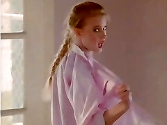 Honest-haired Bonnie Marino has a photosession on a beach