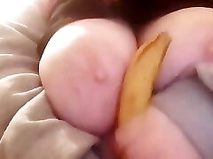 Banana inbetween the tits