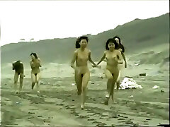 japanese naked dolls running on the beach