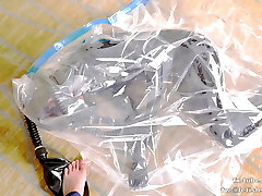 Cute Latex girl on vacuum bag and mask, breathplay