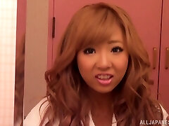 Sexy redhead Asian with biug bra-stuffers in g-string gets pussy waxed