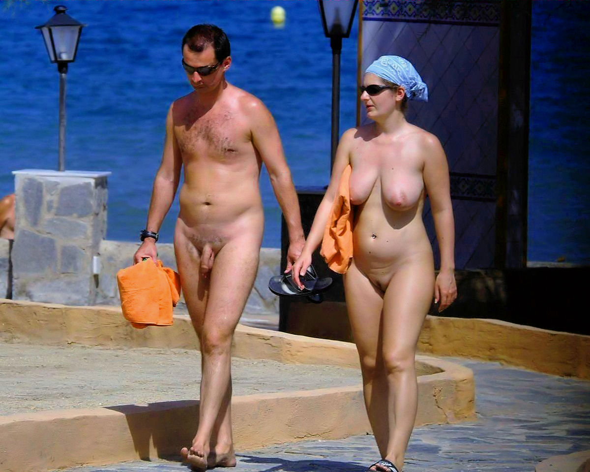 Amateur nudists and theirs beach body painting